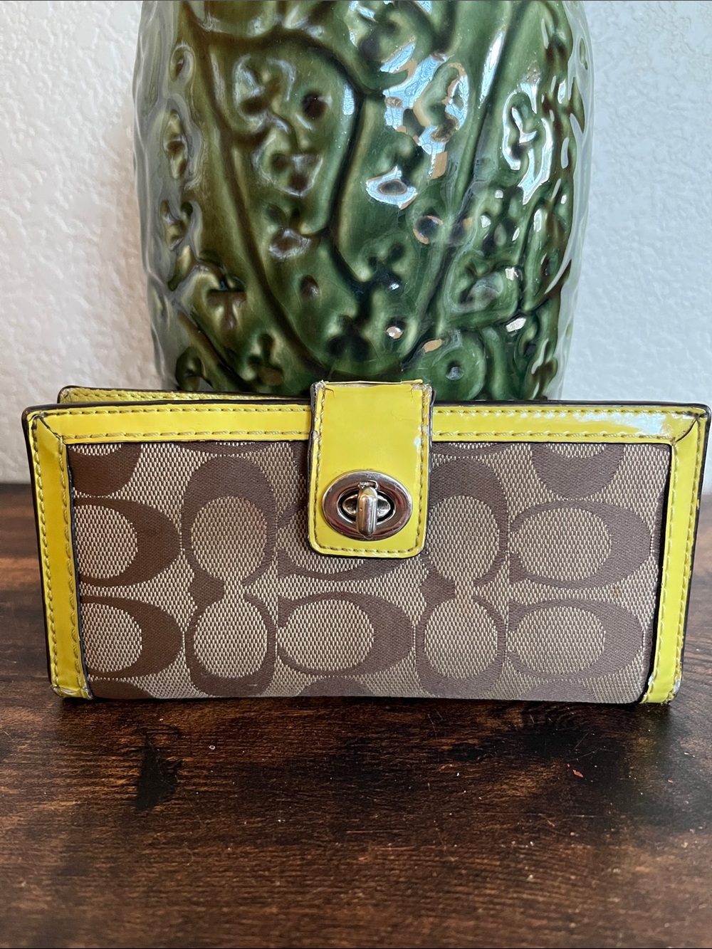 Coach Signature wallet with turnlock closure